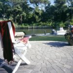 flagstone stone patio deck overlooks a boat canal