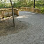 stone patio with wooden deck